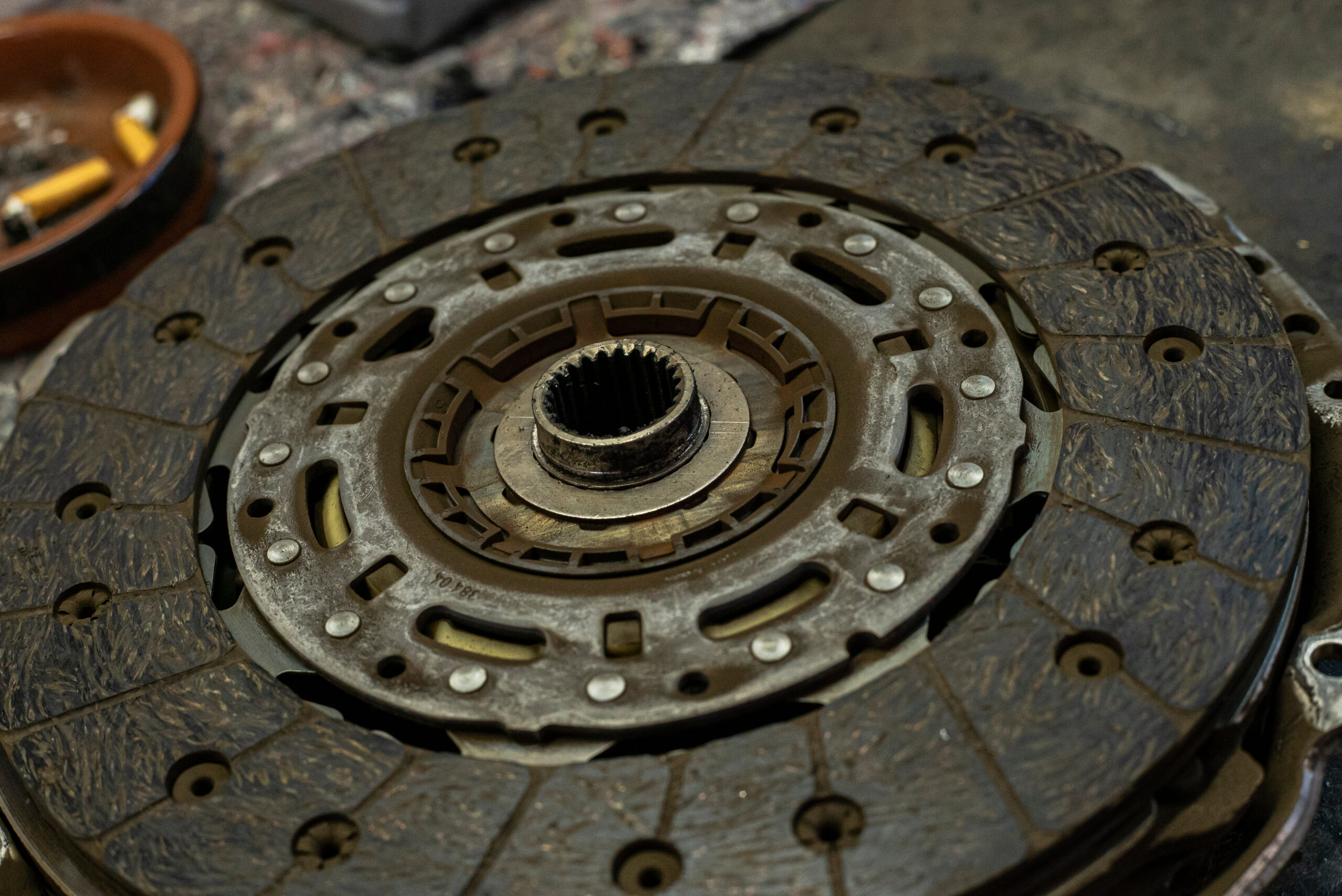 Mechanic inspecting a car wheel bearing assembly